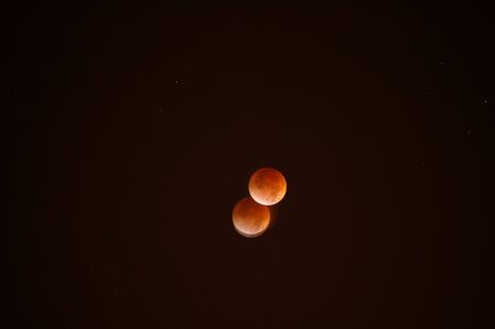 A slow motion view of the moon during a lunar eclipse.の写真素材
