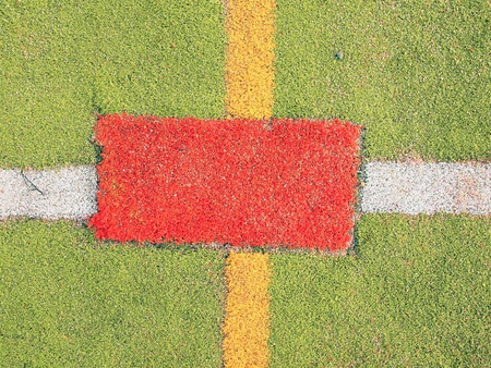 Colorful lines in outdoor handball playground, plastic light green surface on the ground and white, red and blue lines bounds.の写真素材