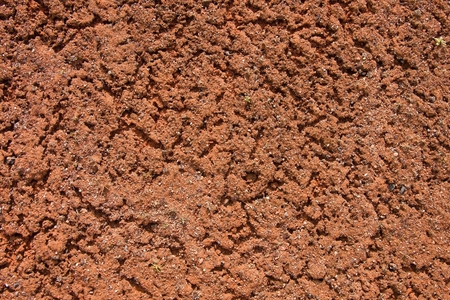 Old dry red crushed bricks surface on outdoor tennis ground.の写真素材