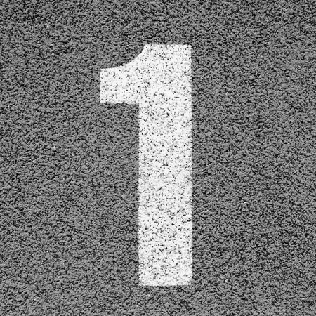 White track number on red rubber racetrack, texture of running racetracks in small stadiumの写真素材