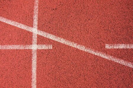 White lines and texture of running racetrack, red rubber racetracks in outdoor stadium