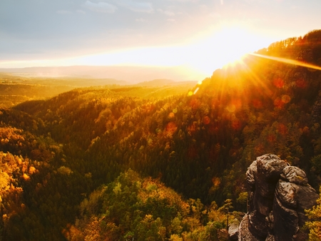 Autumn sunset view over colorful rocks that fall valley of Bohemian Switzerland.の写真素材