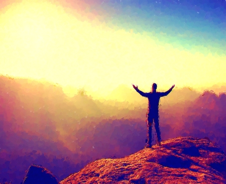 Watercolor paint. Paint effect. Hiker in black. Gesture of triumph. Tall tourist on the peak of sandstone rock in national park Saxony Switzerland watching down to landscape.の写真素材