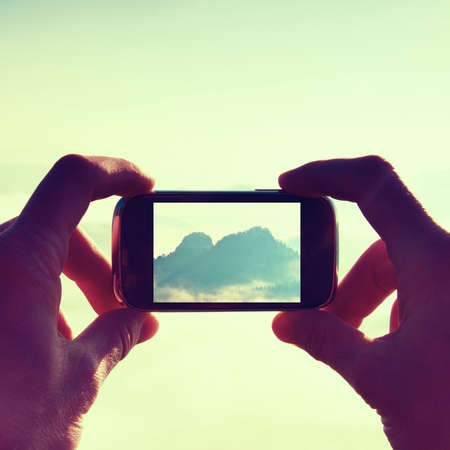 Smart phone mobile photography of sunny rocky mountains landscape. Focus to detailの写真素材