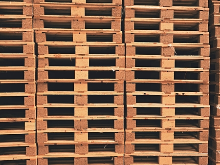Stock of new wooden euro pallets at transportation company.の写真素材