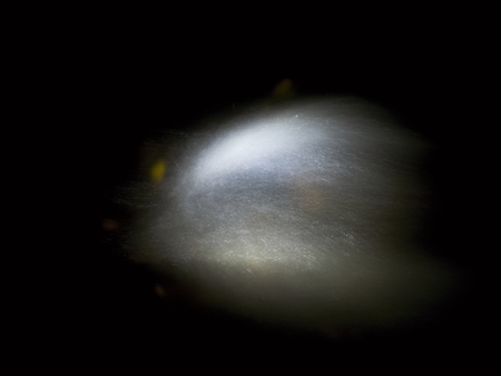 Shinning drops. Cascade of small weir on mountain stream, water is running over blocks and bubbles...