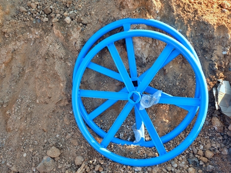 New valve wheel for 500 mm valve. Industrial Valve Wheel ready for assambly on dry clay. Repairing of water pipeline supply.の写真素材