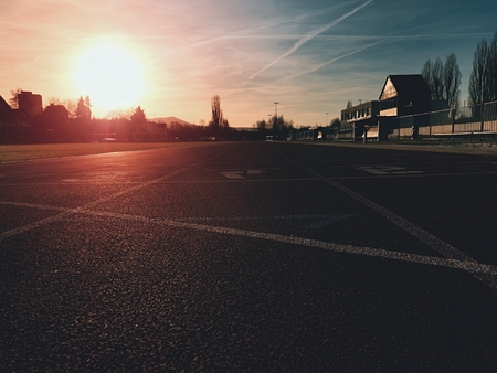 Detailed  Running Track At A Sport Stadium. Close up red racetrack ground on outdoor stadium. Sun rays.  Sport and healthy lifestyle concept, training workoutの写真素材
