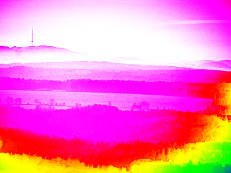 Thermography photo. Animal view. Spring misty landscape. Hills, forest and fog with changed colors to ultraviolet.の写真素材