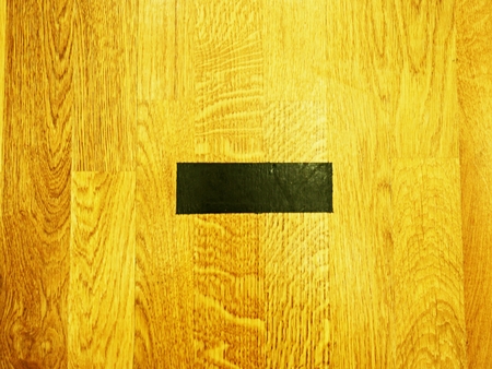 Black lines in hall playground. Worn out wooden floor of sports hall with colorful marking linesの写真素材