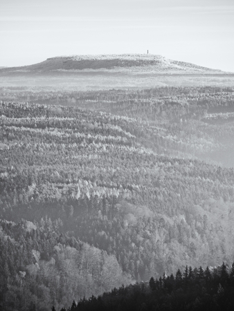 View on a big rounded hill from plane, beautiful fantastic view. Fantastic dreamy sunrise, mountain above misty valley. Tourist resort.の写真素材