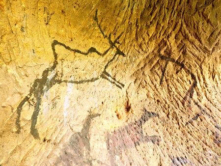 Black carbon paint of deer on sandstone wall, prehistorical picture. Abstract art in sandstone cave....