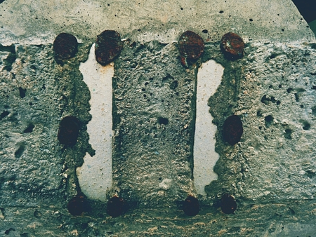 Steel or iron rod in concrete mass, detail on construction site. Concrete railway ties Stored for reconstruction of old railway station.の写真素材