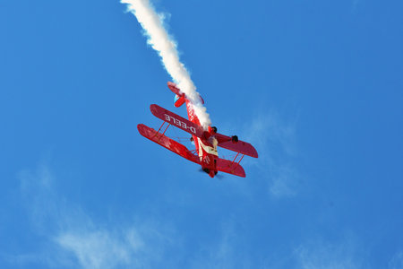 Memorial Airshow, 24th of June 2017, Roudnice, Czech Republic. Bucker Jungmeister in flight, smoke...