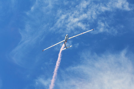 Memorial Airshow, 24th of June 2017, Roudnice, Czech Republic. Flying Glider aerobatic team withlight sailplane showing his performance, smoke effectのeditorial素材