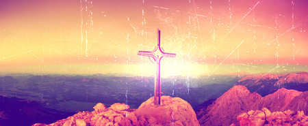 Film grain effect. Lens flare light, strong effect.  Cross on peak of Hoher Goell. Iron crucifix at mountain top in Alp at Austria Germany border.の写真素材