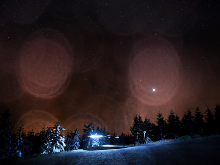 Film grain effect. Hut in winter mountains .. Cross country trails in mountains. Evening in winter. Fresh snow. Chill night.の写真素材