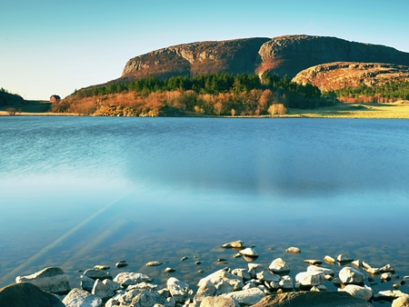 Red houses of the fishing village. Traditional red white building in small port, coastline of cold north sea, Norway.の写真素材
