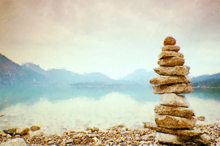 Oil painting, brush strokes. Balanced stone pyramide on shore of blue water of mountain lake. Poor lighting conditions.の写真素材