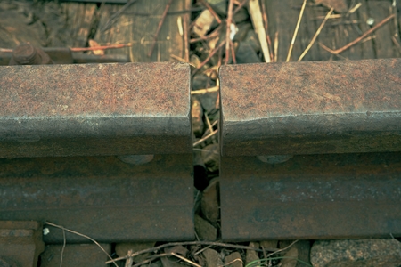 Old rusty railways. Railway details of rails joint with screws and nuts. Selective focusの写真素材