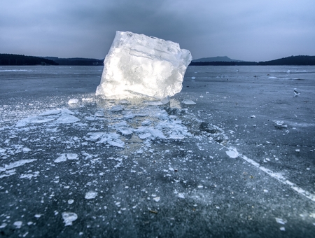 Icebergs and ice floes reflected evening light, Flat icy level in the silent  bay. Drift ice in lagoonの写真素材