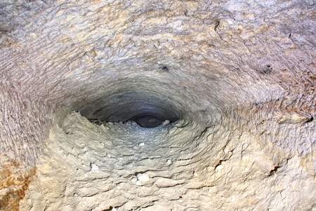 The old sandstone water tunnel, mined caves.  The cave. Sandstone tunnel moistened walls. Dry channel carved in the rocky undergroundの写真素材