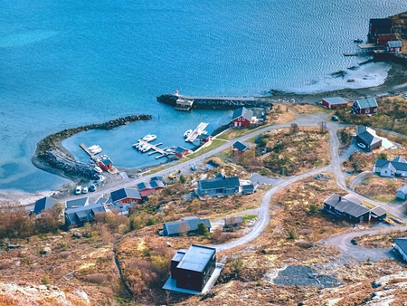 Norway Scandinavia landscape. Aerial view of bay with fishing village. Distinctive scandinavian scenery with mountains, sea and sheltered bays.の写真素材