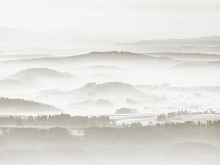 Misty autumn mountain hills and landscape. Filtered image with cross processed vivid effect.の写真素材