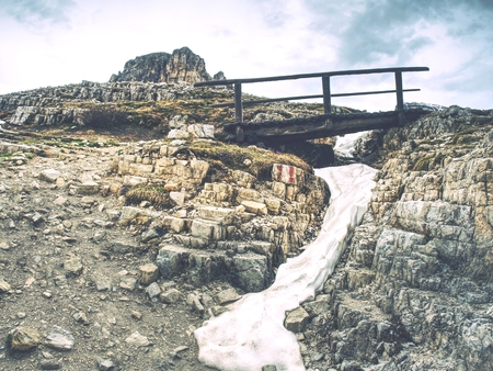 Wooden handrail and sign on trekking path at the Dolomites mountains at the Italy. Tre Cime di Lavaredoの写真素材