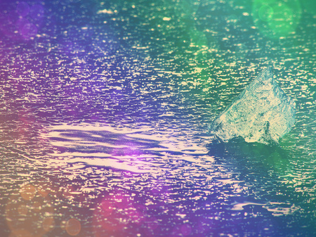 Burning Melting glaciers and rising river levels. The result of dangerous human actions. Hipster filter.の写真素材