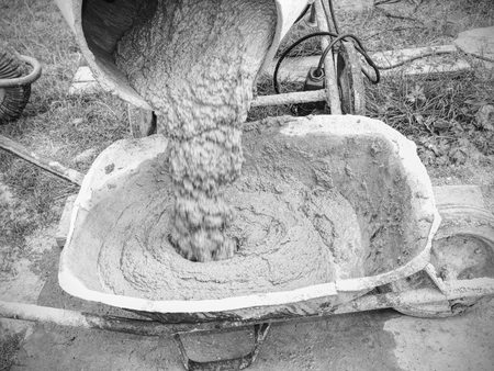 Mix of wet cement concrete in mobile mixer. Concrete mixing for building in detail.の写真素材