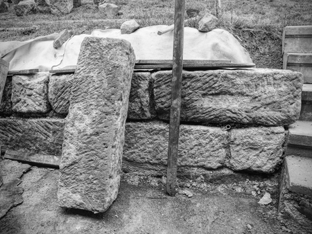 Authentic sandstone wall texture. Reneval old house wall combine natural sandstone blockss with modern concrete material in cleftsの写真素材