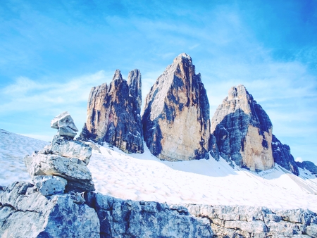 Stones gravel stack bellow Alpine mountain summit. Spring trail around Tre Cime di Lavaredo, well known also as Drei Zinnen , Dolomite Alps, Italy. Europeの写真素材