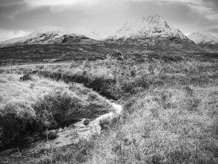 Mystic atmosphere awithin trek t River Etive in Glencoe moutains In Winter.  Cold windless winter morningの写真素材