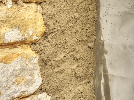 Sandstone block wall on ancient building, traditional  medieval architectureの写真素材