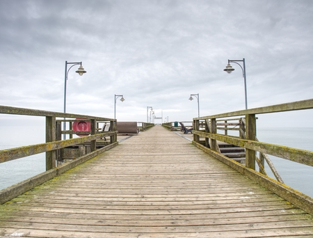 Moody colorful sunset at a famous marine pier at the Baltic resortの写真素材