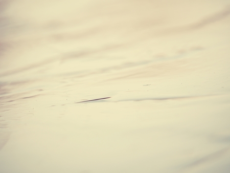 Dark crust of glistening ice with light reflections. Ice overing the lake.の写真素材