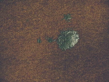 Gray brown woolen texture from worn carpet on house floor. Texture of textile rug with striped...