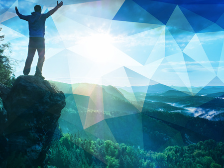 Abstract, over filtered. Hiker in outdoor windbreaker jacket enjoys the magnificent view.  The feeling of strength and power. Wonderful view.の写真素材