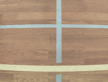 White Line On Wooden Floor Court. Gym for playing futsal, mini-football. Folded wooden parquet on...
