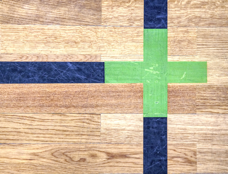 White Line On Wooden Floor Court. Gym for playing futsal, mini-football.  Plank pier in the light of the setting sunの写真素材