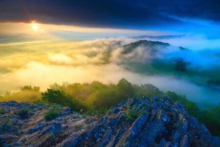 Exposed sandstone rocks with fog. Misty winter rocky park. Heavy mist in valley bellow view point.の写真素材