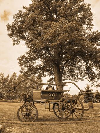 Wooden antique fire-fighting syringe from 1895. Fire extinguishing equipment.の写真素材