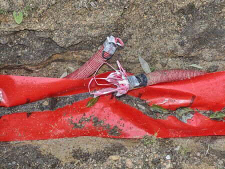 Wire protection for city light system in park. Steel grounding cable in system.
