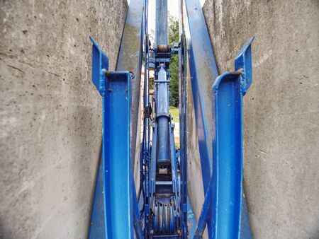 Small lift system.  Mechanism of lift with beams and wheels from building crank.