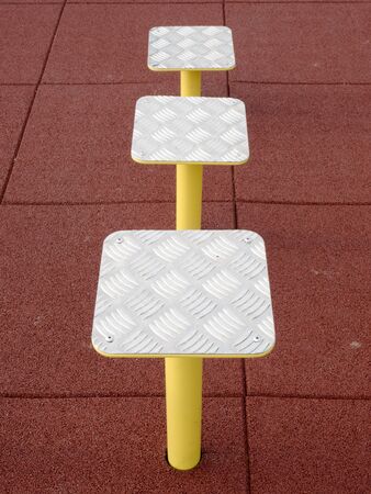 Detail of fitness steps in workout corner. Platform steps in the gym. Popular outdoor fitness...