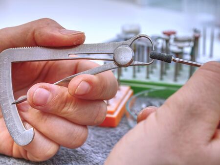 Dental tools on the table in dental laboratory. Orthodontic, dental technician working on false teeth. table with dental tools.の写真素材