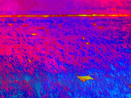 Soccer or football training cone on the green field.  Abstract filter.の写真素材