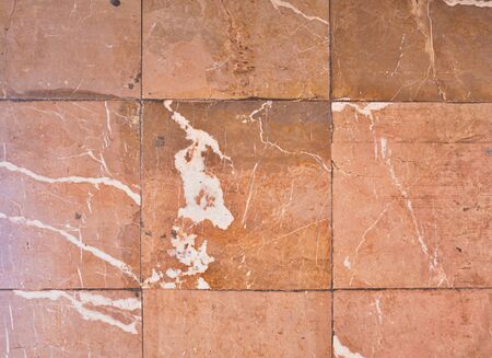 Scratches and cracks on red purple marble floor tiles in cathedral. の写真素材
