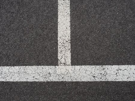 Lines painted with white color on empty parking spaces. Painter roadの写真素材